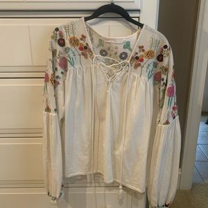White long sleeve top with floral design